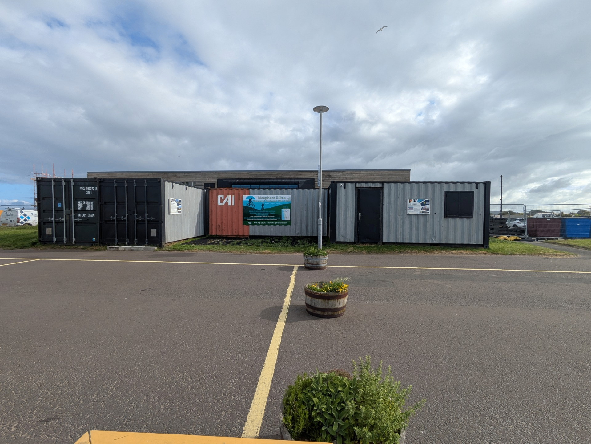 Wide view of the Biosphere Bikes shipping container hub on Girvan seafront.